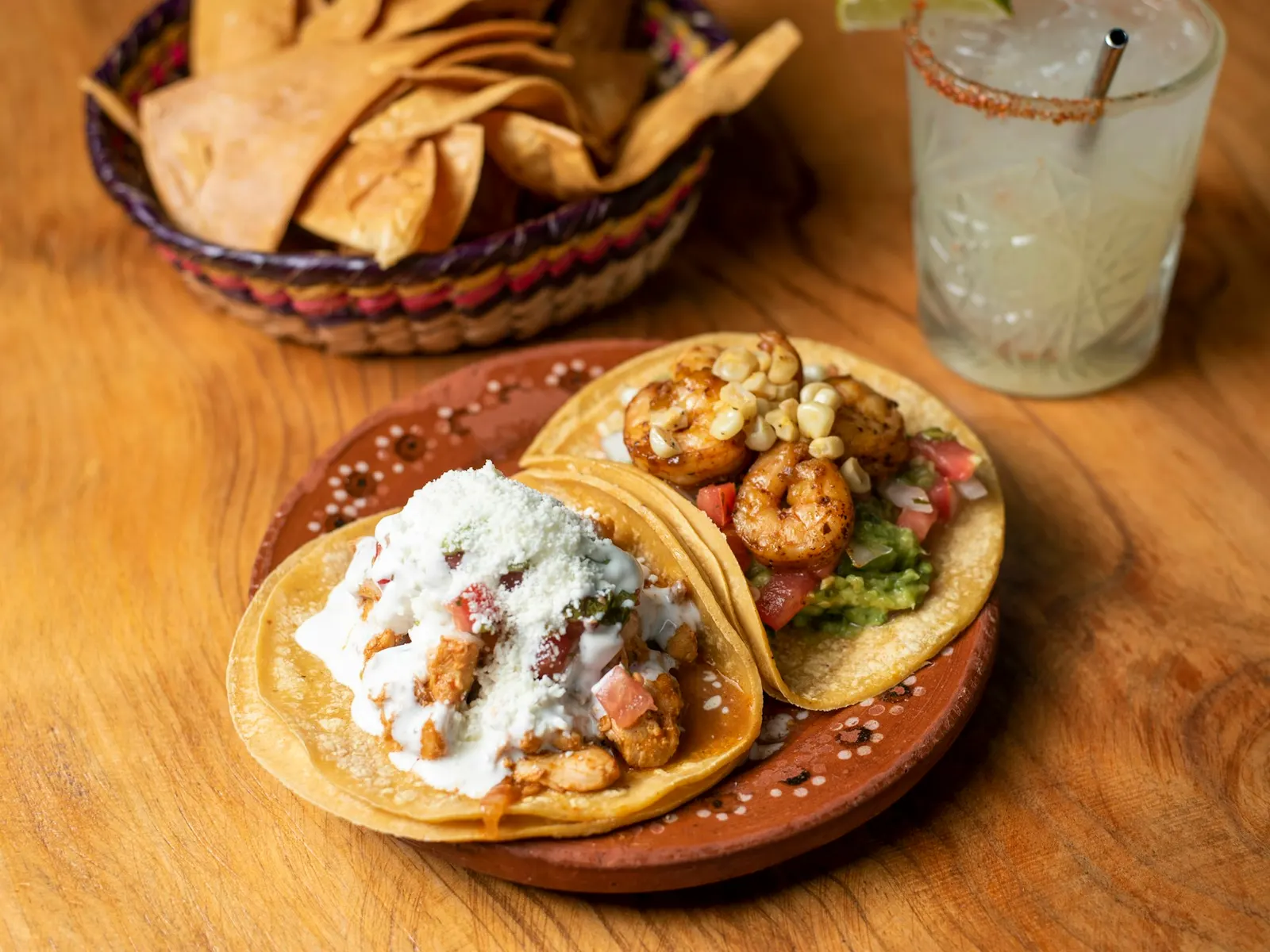 Shrimp tacos with creamy slaw on a wooden board